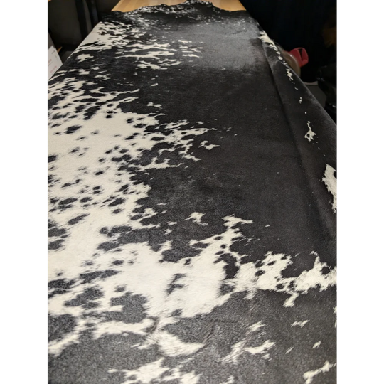 Extra large cowhide rug with black and white spots, leather texture