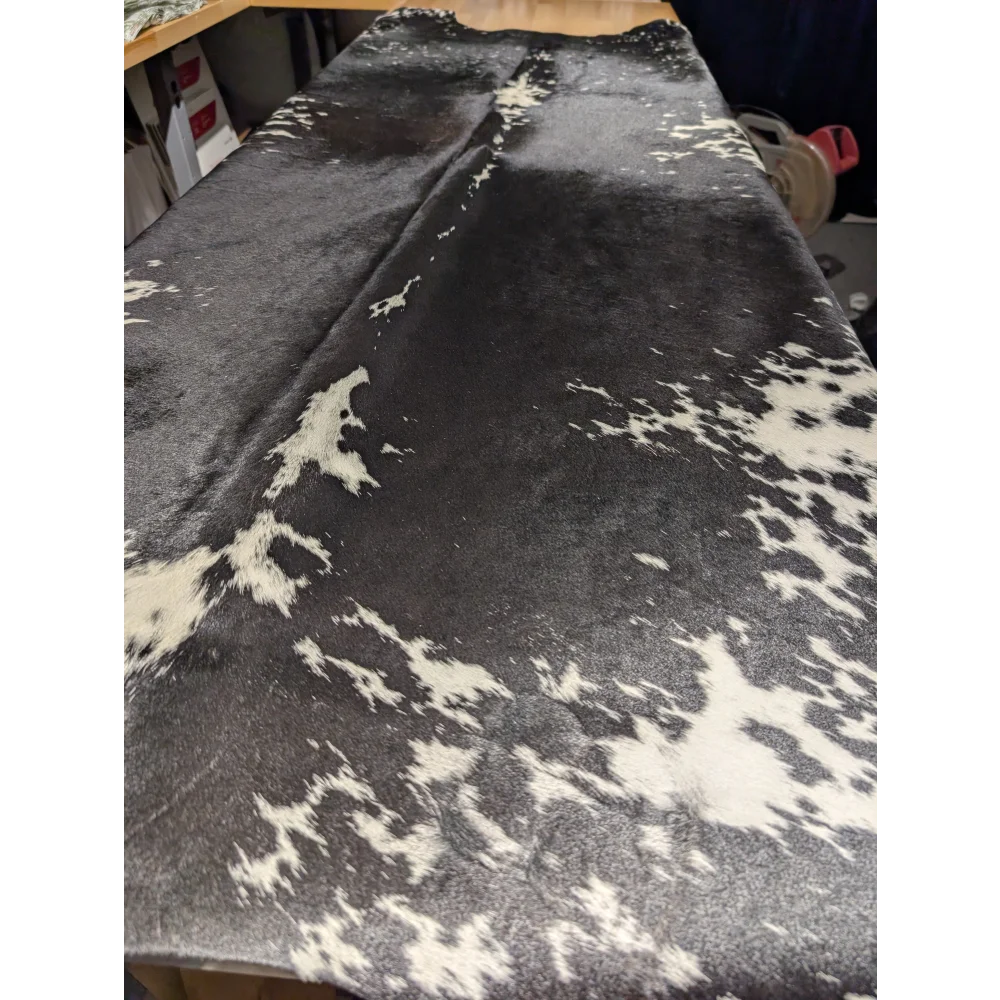 Extra large cowhide rug with black and white spots, leather texture