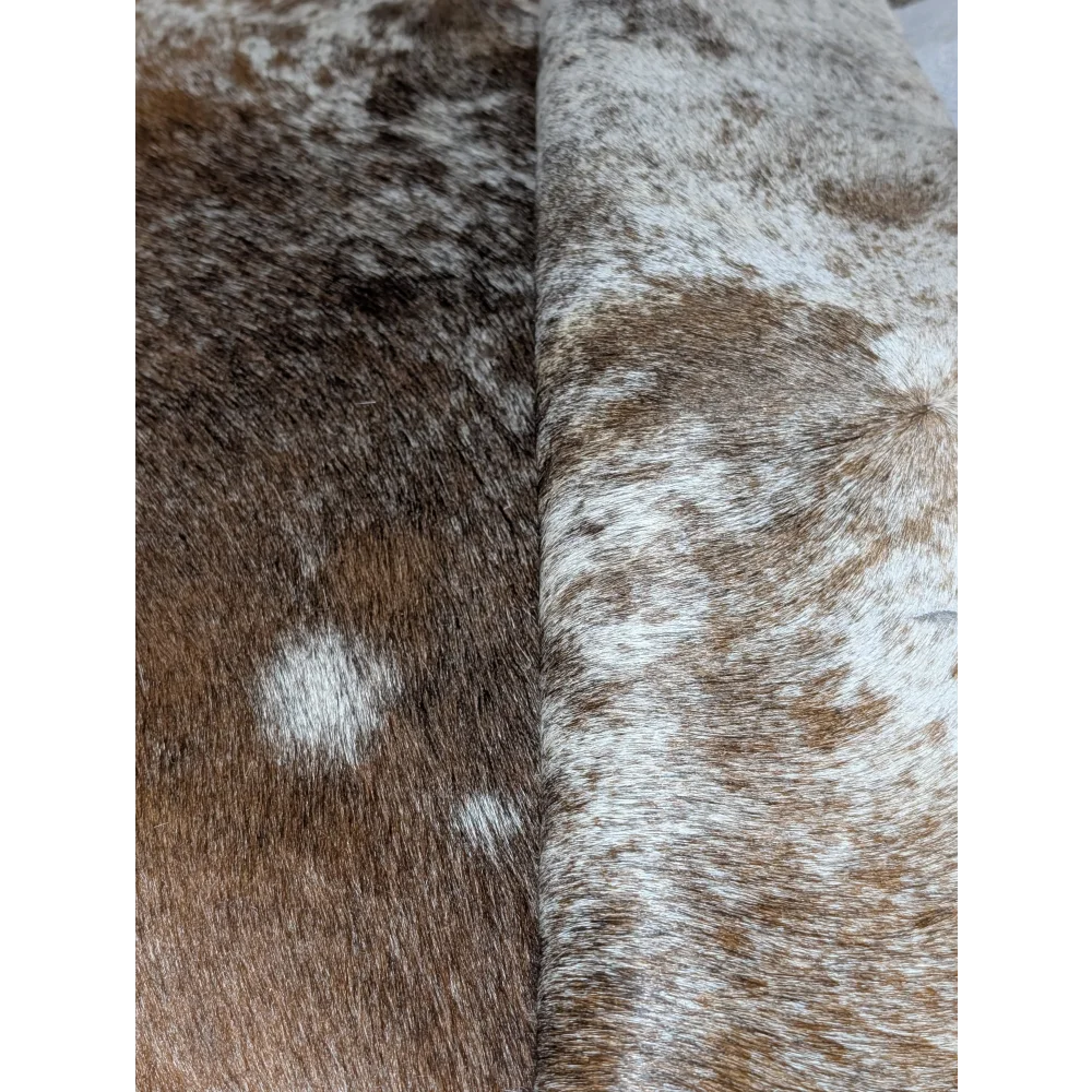 Extra large cowhide rug with brown and white speckled faux fur