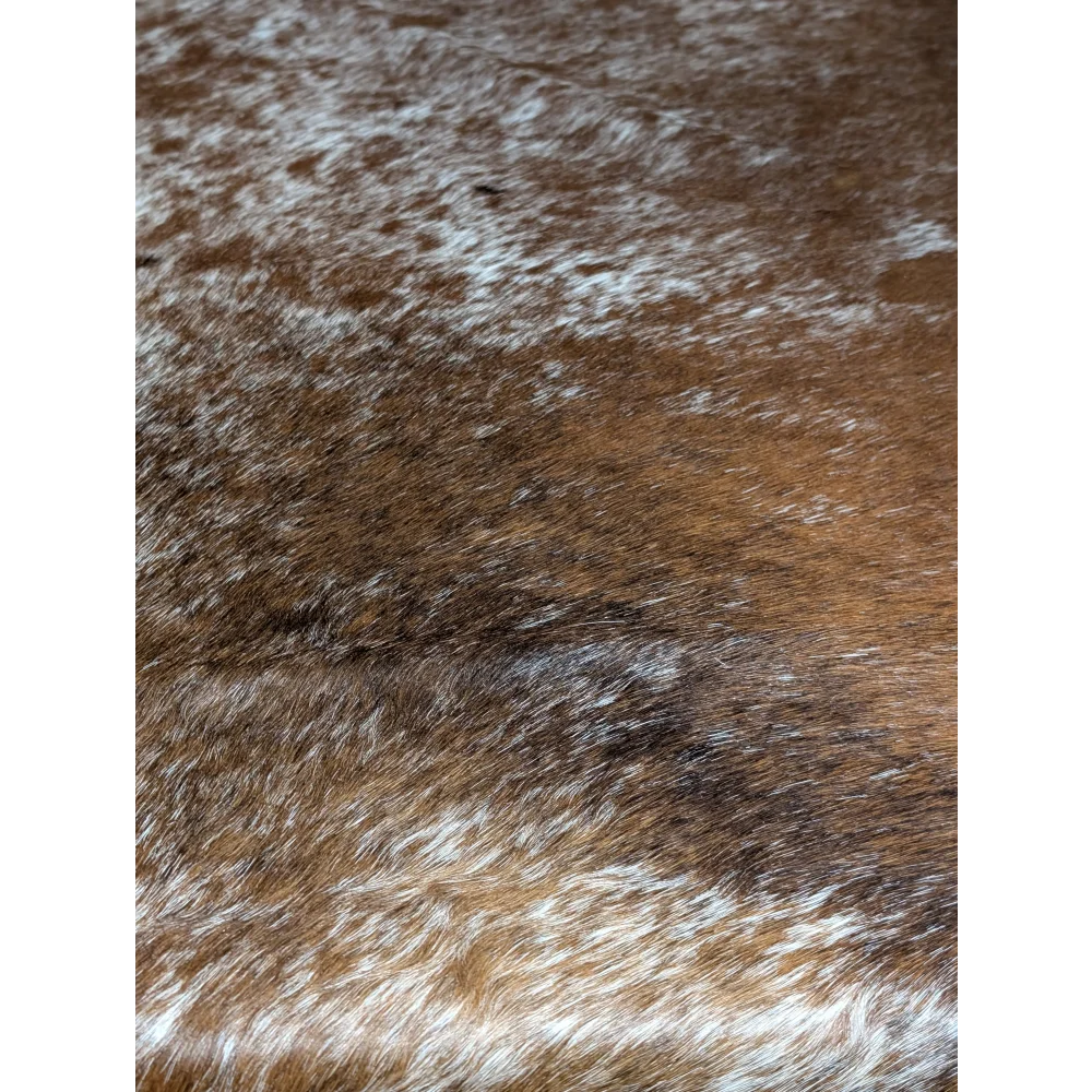 Extra large cowhide rug with brown white fur and subtle pattern aura