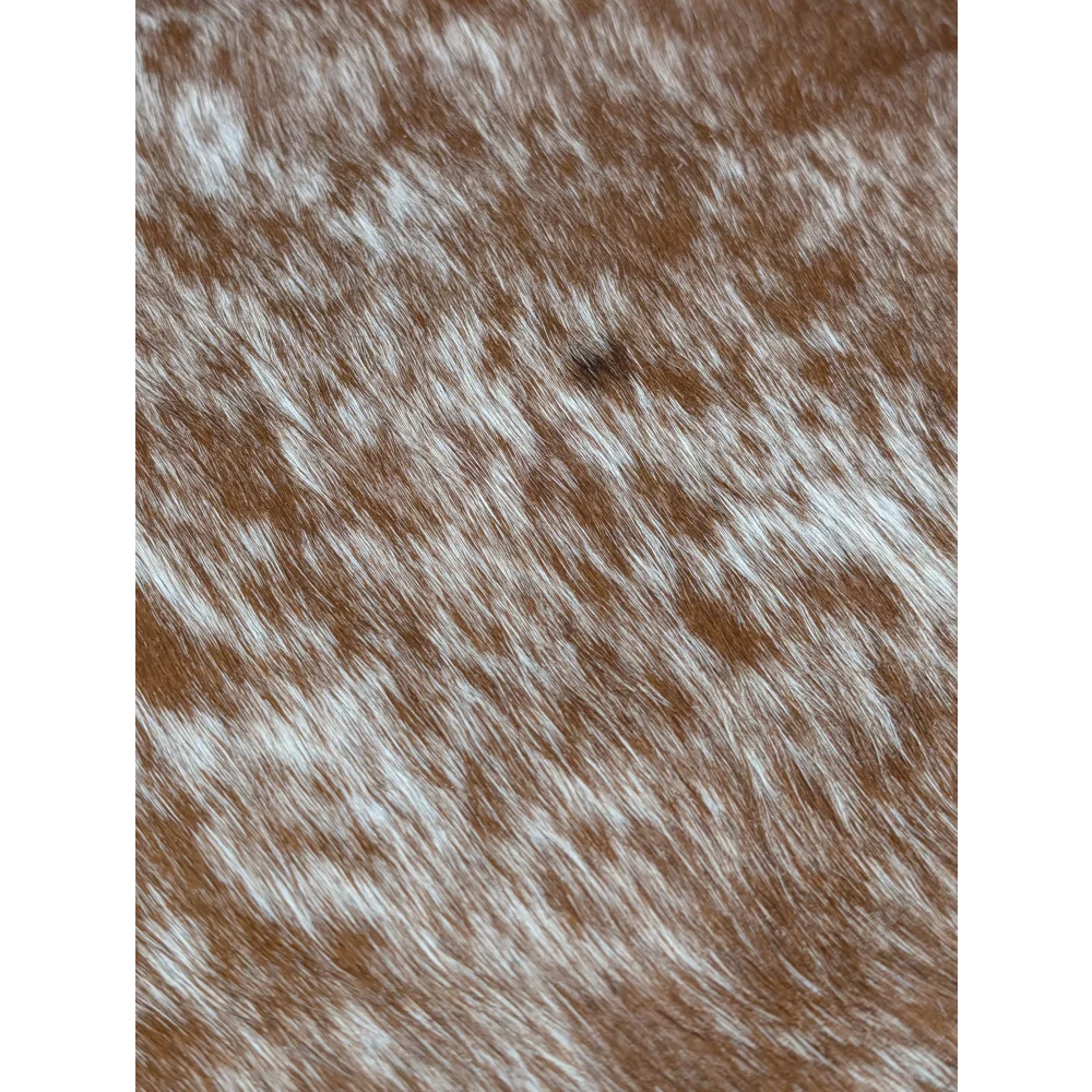 Extra large cowhide rug with brown and white speckled texture