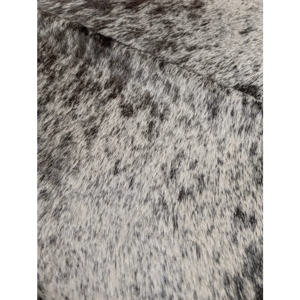 Extra large Angus Oliver cowhide rug with black and white speckled texture