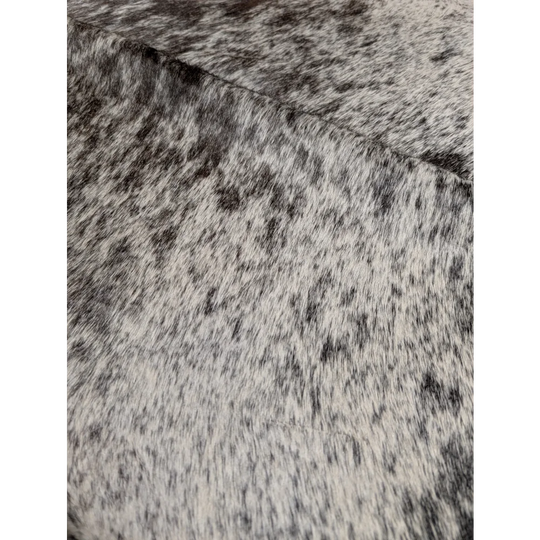 Extra large Angus Oliver cowhide rug with black and white speckled texture