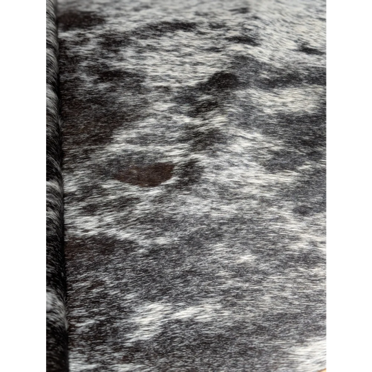 Black and white speckled extra large cowhide rug by Angus Oliver