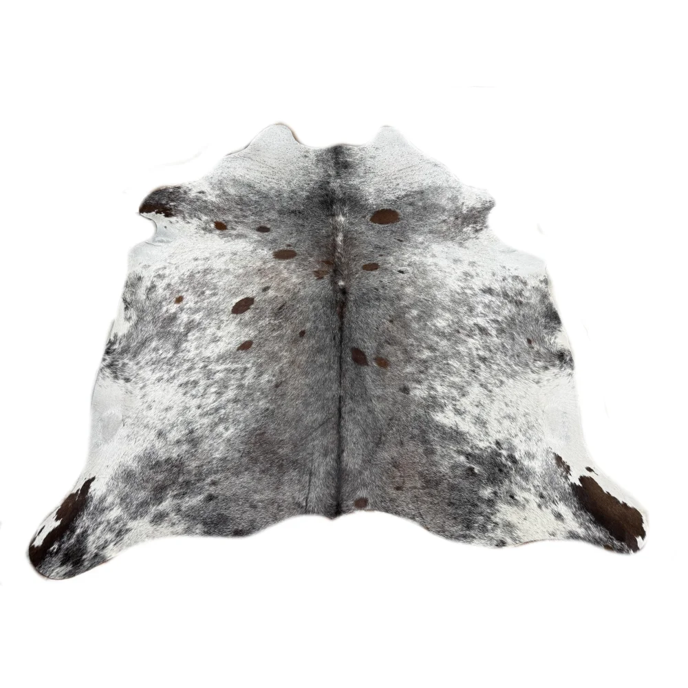 A beautiful extra large cowhide rug with a white base and gray and dark brown patches perfect for large cowhide decor