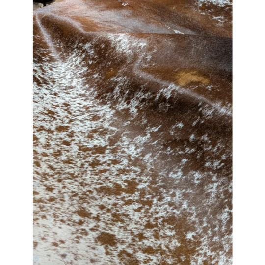Brown and white speckled cowhide wallet chain on extra large SaltPepBRN #149 rug