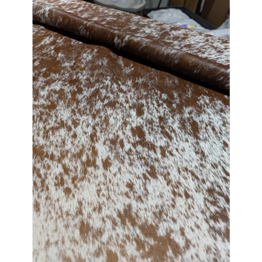 Extra large cowhide rug in brown white speckled faux fur, plush texture