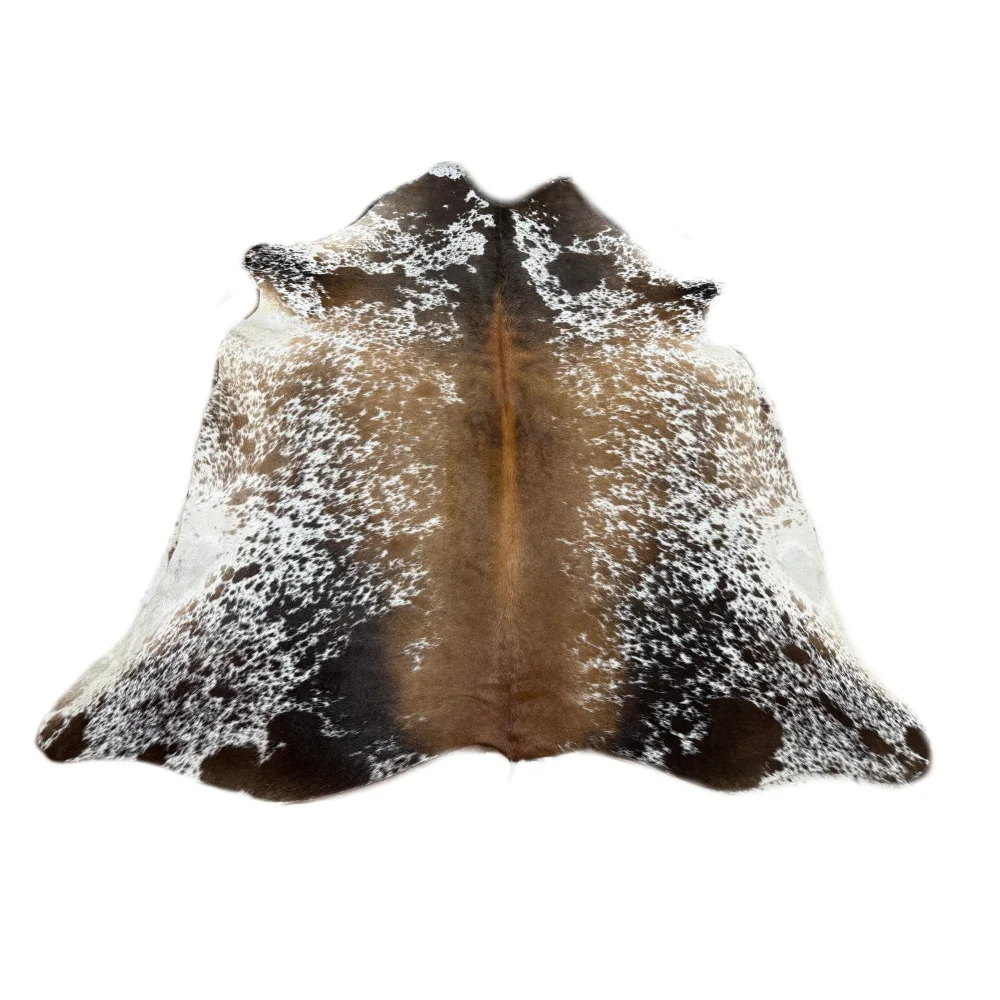 Beautiful large cowhide rug with brown and white speckled natural fur texture perfect for rustic charm decor