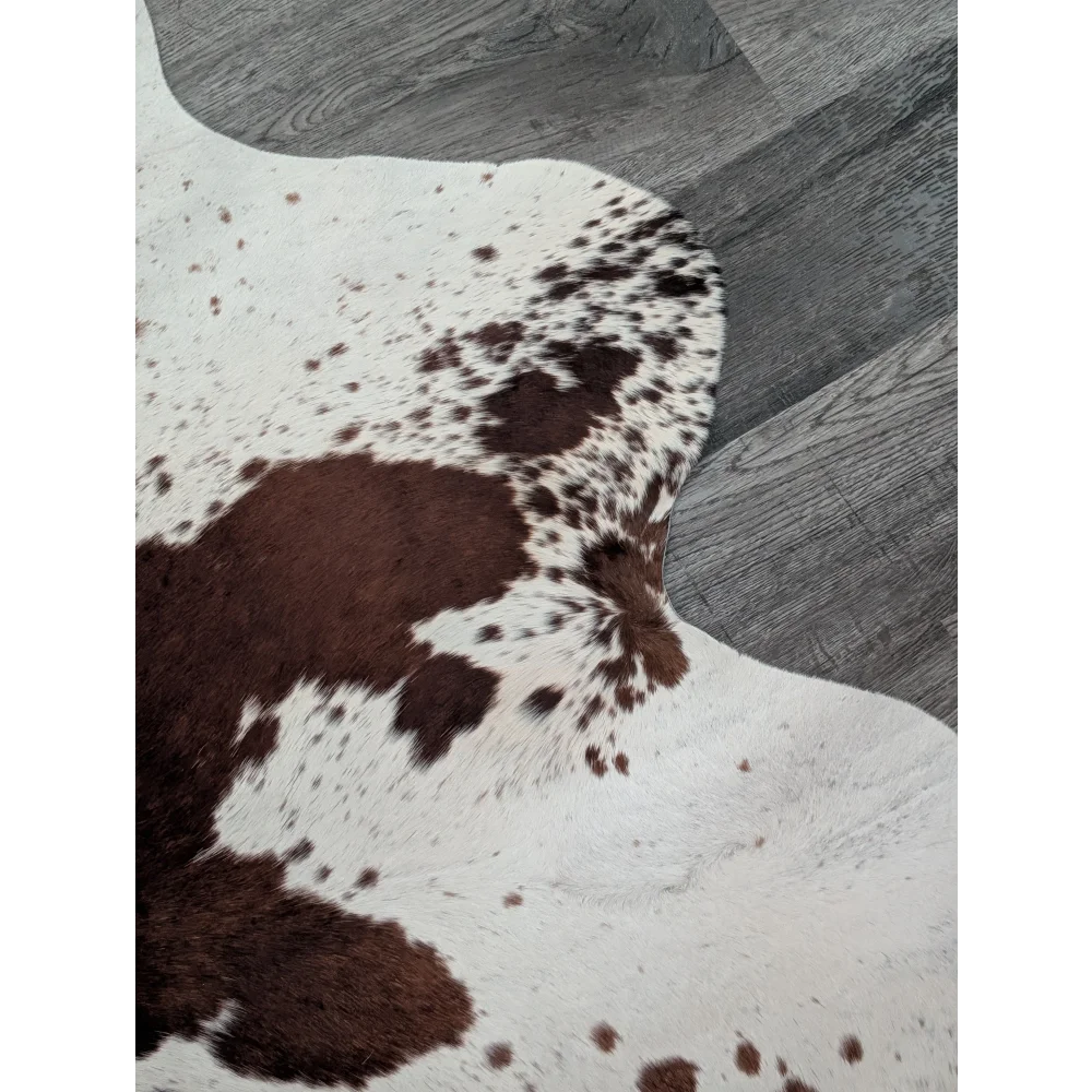 Brown and white spotted extra large cowhide rug saltpepbrn198 with a natural textured surface perfect for beautiful rugs