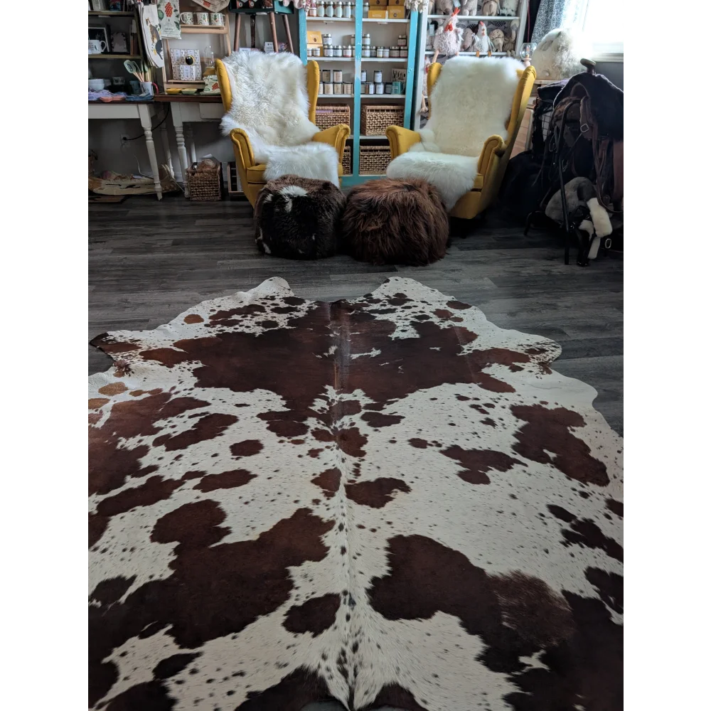 Brown and white extra large cowhide rug with natural irregular patches perfect for beautiful rugs collection