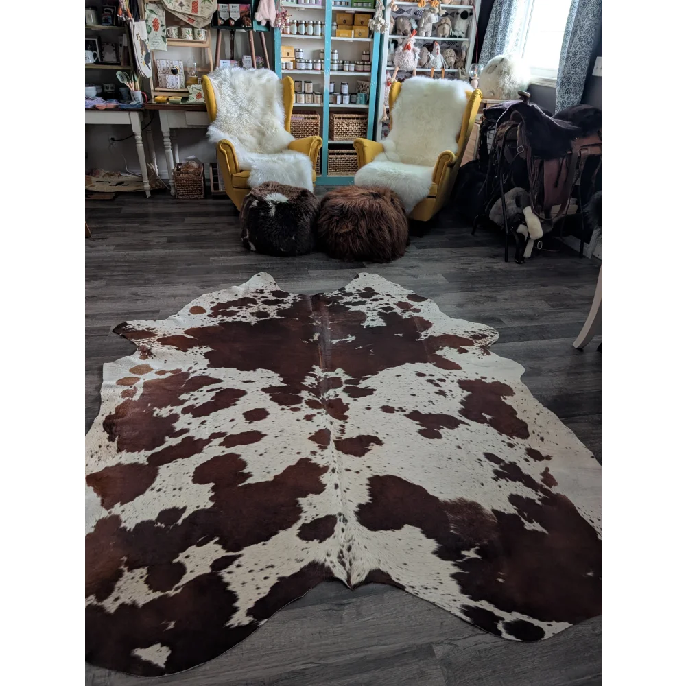 Brown and white extra large cowhide rug with natural irregular patches perfect for beautiful rugs and decor