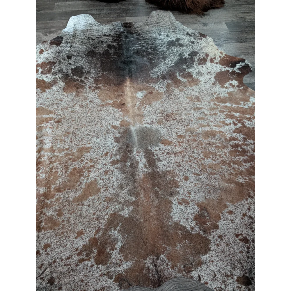 Brown and white extra large cowhide rug with natural irregular patterns perfect for beautiful rugs and decor