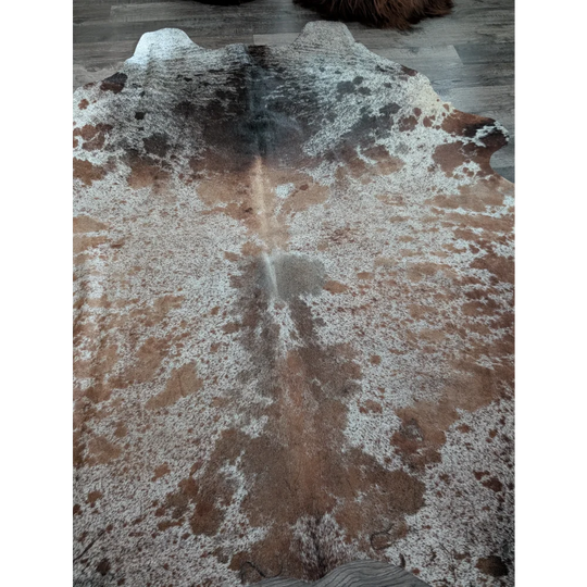 Brown and white extra large cowhide rug with natural irregular patterns perfect for beautiful rugs and decor