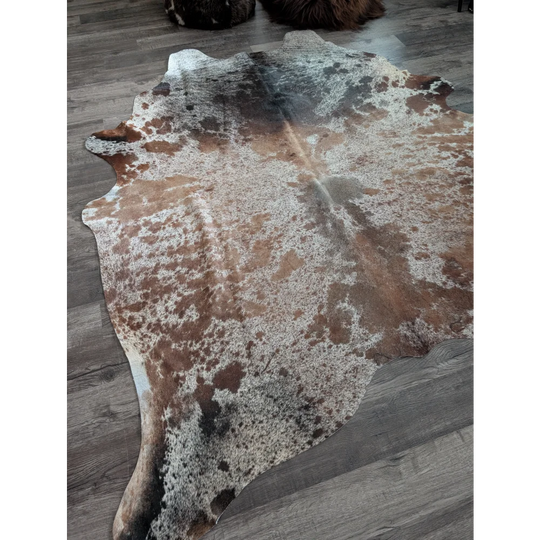 A beautiful extra large cowhide rug saltpepbrn 203 in natural tones with brown white and black mottled patches