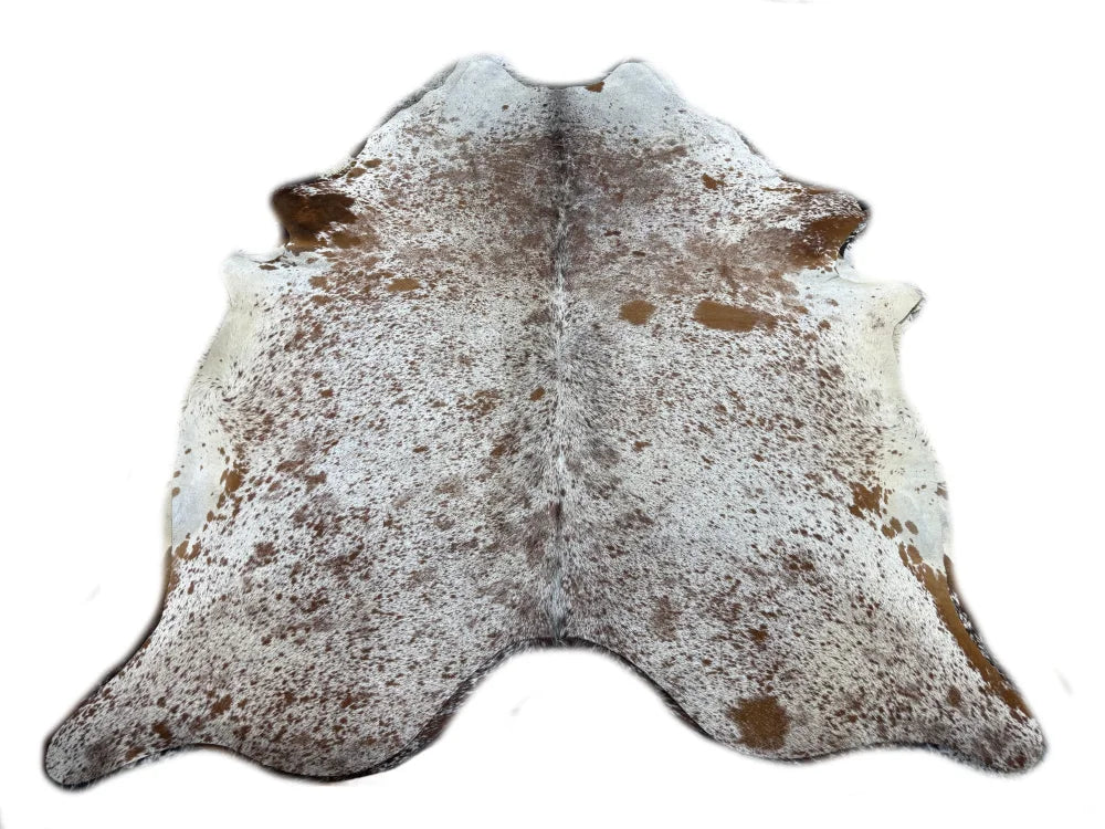A large cowhide rug saltpepbrn 214 with white base brown speckles and unique rustic charm arriving soon