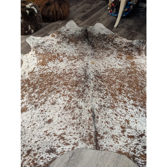 Large cowhide rug saltpepbrn31 with brown and white speckles and natural irregular edges extra large 98 by 86 inches