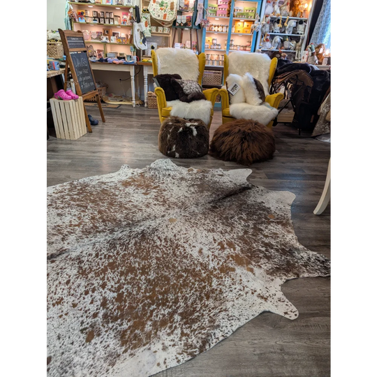Brown and white extra large cowhide rug saltpepbrn31 with natural irregular patterns 98 by 86 inches