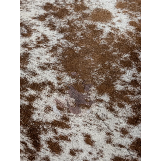 Extra large brown and white cowhide rug saltpepbrn31 with a natural textured surface 98 by 86 inches