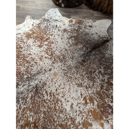 Brown and white speckled extra large cowhide rug saltpepbrn31 with natural irregular edges 98 by 86 inches