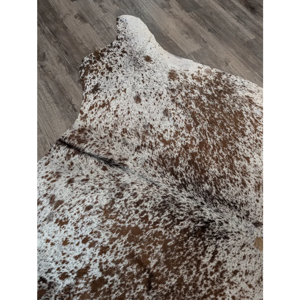 Extra large brown and white spotted cowhide rug 98 by 86 perfect for a large cowhide statement piece