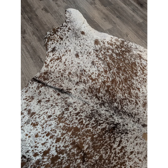 Extra large brown and white spotted cowhide rug 98 by 86 perfect for a large cowhide statement piece