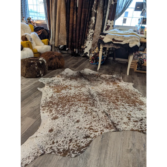 Brown and white extra large cowhide rug saltpepbrn31 with natural irregular edges perfect as a large cowhide decor
