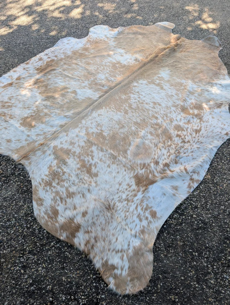 Large cowhide rug saltpepbrn#326 in tan and white with rustic charm by angus oliver measuring 94 by 81 inches