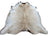 A large cowhide rug saltpepbrn#327 with soft beige white fur and dark brown patches adding rustic charm arriving soon