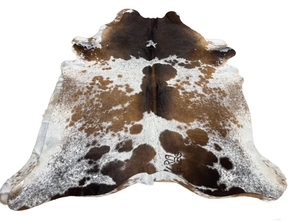 Large brown and white spotted cowhide rug saltpepbrn#358 with natural fur texture and rustic charm arriving soon