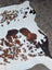 White cowhide rug with brown and black patches large cowhide rug by angus oliver with rustic charm arriving soon