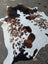 Brown and white angus oliver large cowhide rug with rustic charm dark brown spots on creamy base arriving soon saltpepbrn358