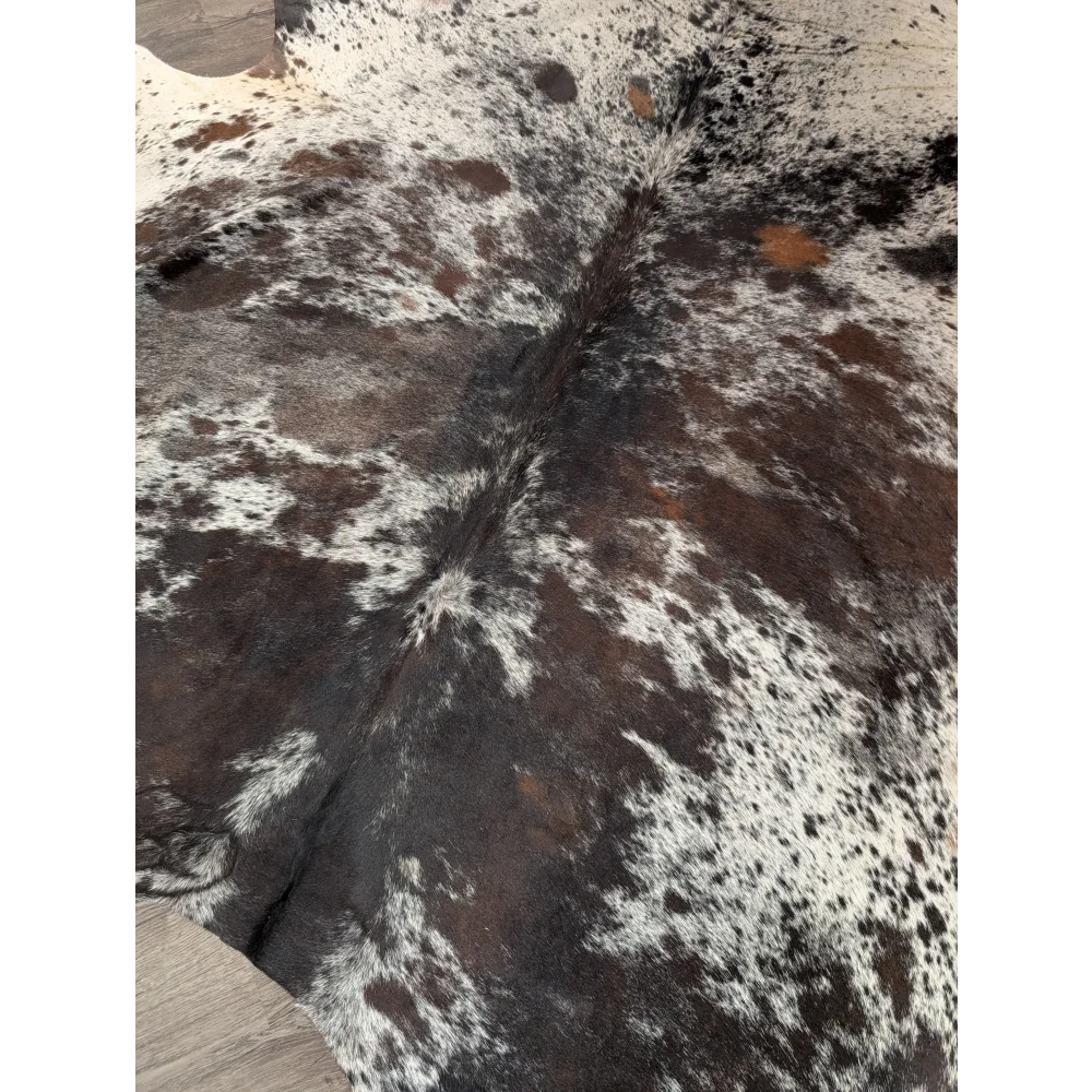 Rustic brown and white extra large cowhide rug with natural fur texture saltpepbrn