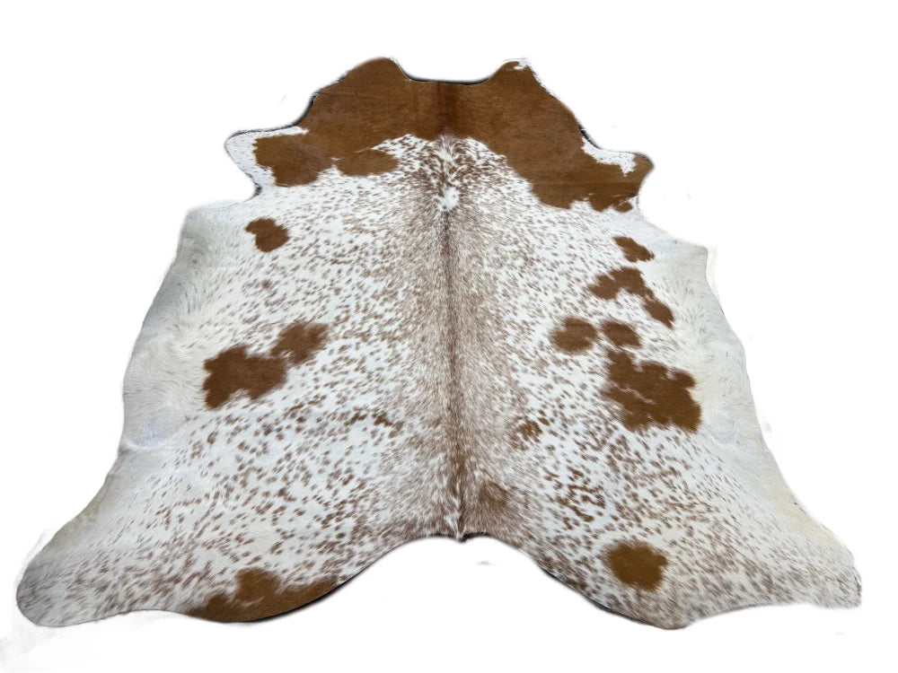 Brown and white saltpepbrn#450 cowhide rug with natural fur texture large cowhide that cowhides make beautiful rugs