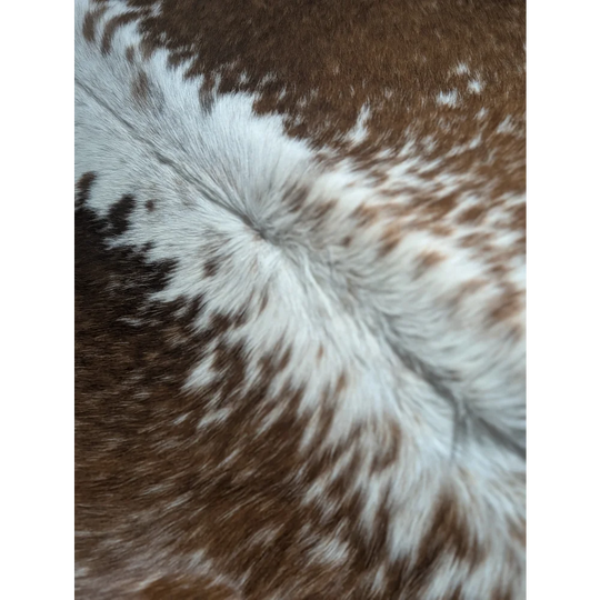Gorgeous extra large cowhide rug with brown and white spotted fluffy fur