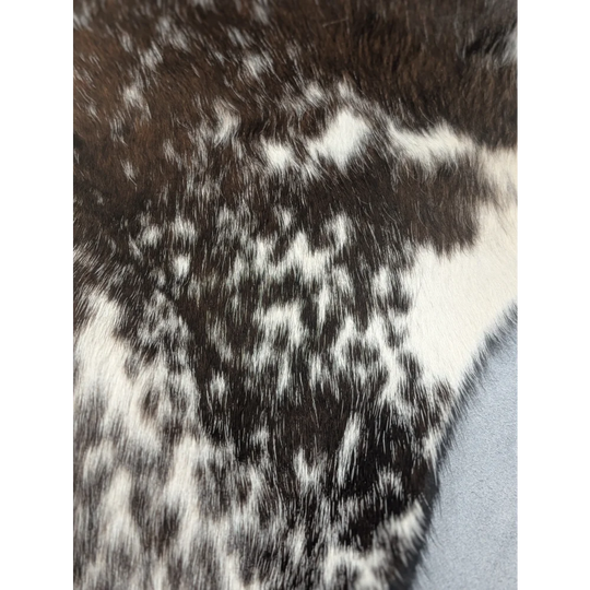 Extra large cowhide rug with black and white spotted sweater texture