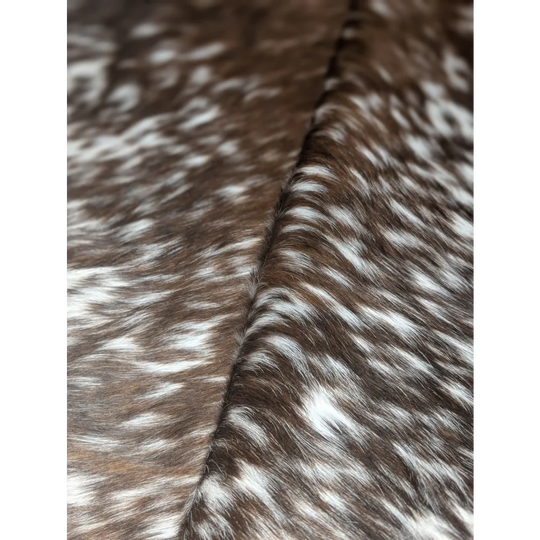Extra large cowhide blanket in brown white camo pattern, textured via tanning process