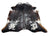 A natural extra large cowhide rug with rustic charm and unique black white and brown spotted pattern arriving soon