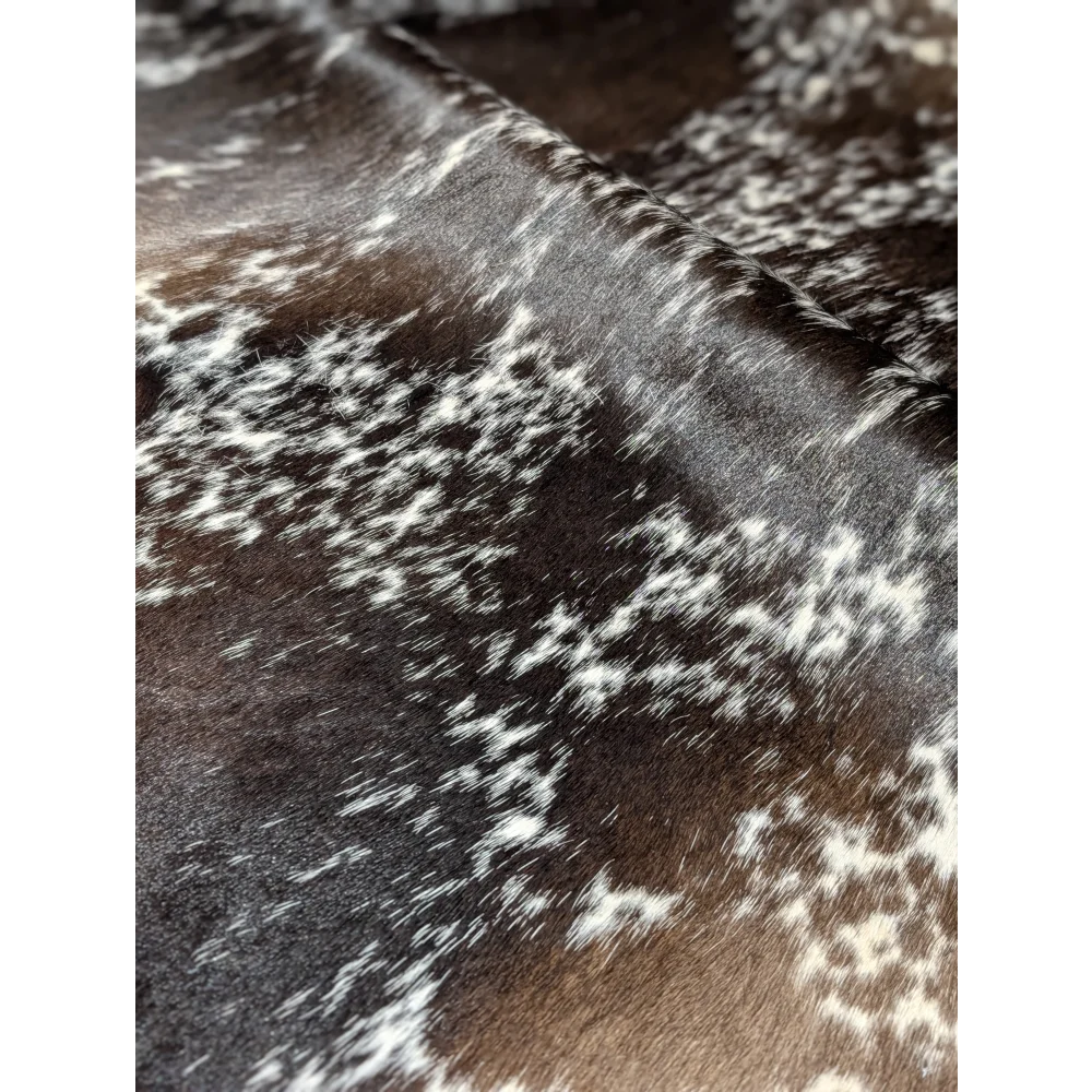 Extra large cowhide rug with brown and white snowflake plush blanket pattern, soft underfoot