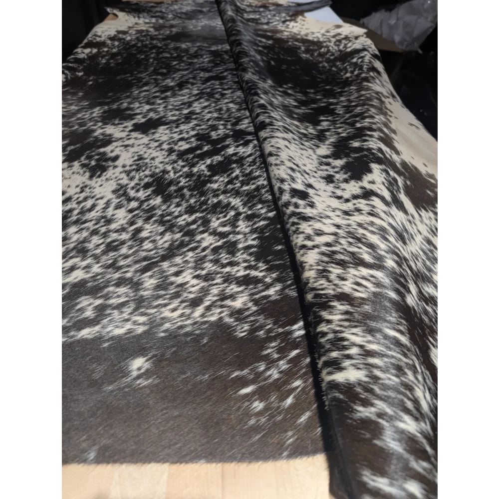Extra large cowhide rug with black and white speckled pattern, soft underfoot