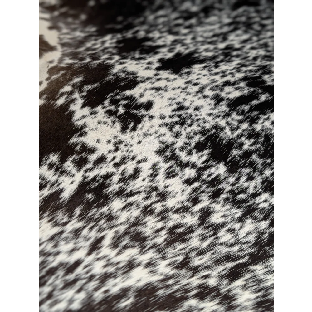 Extra large black and white cowhide rug with speckled pattern, soft underfoot