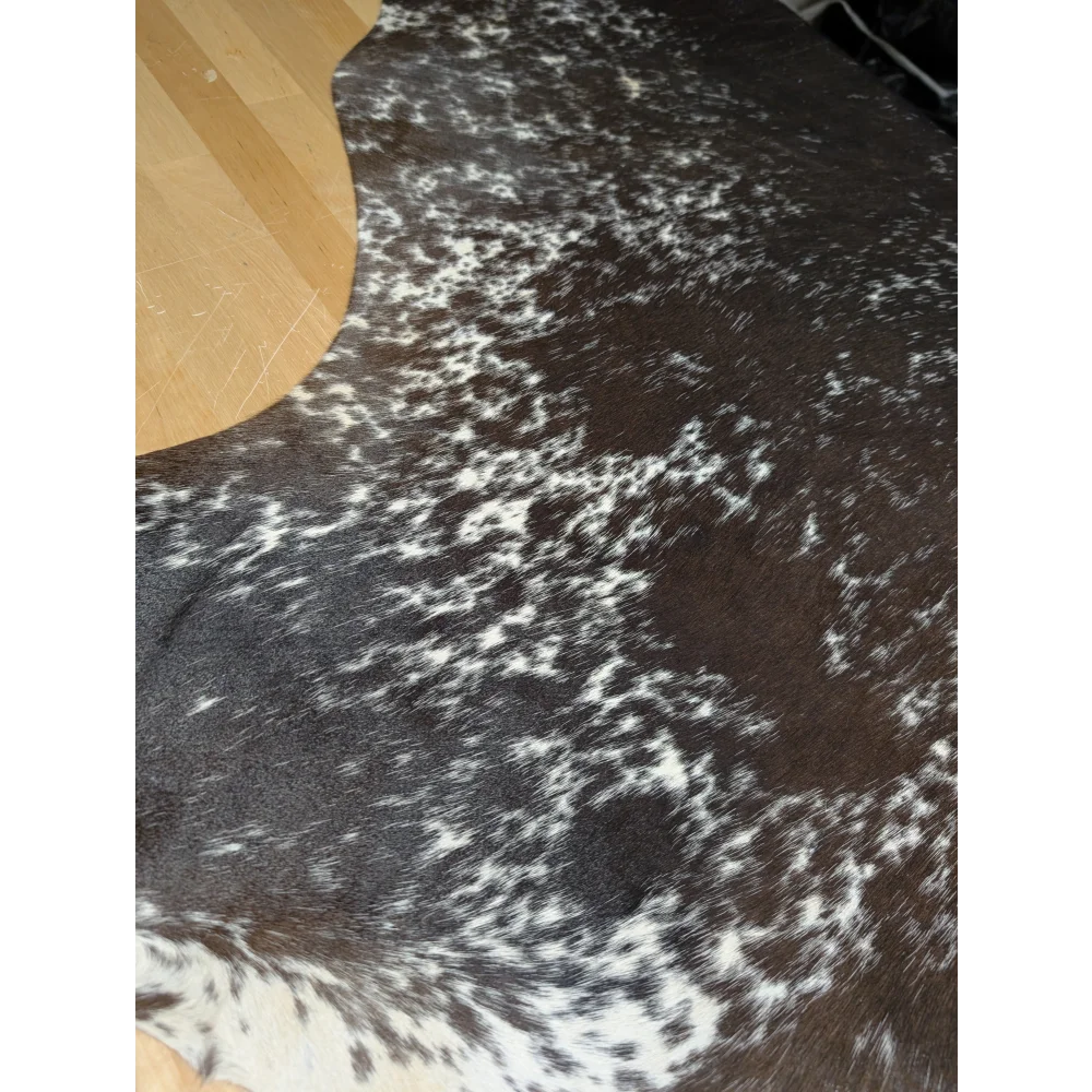 Extra large cowhide rug with black and white speckled pattern, soft underfoot