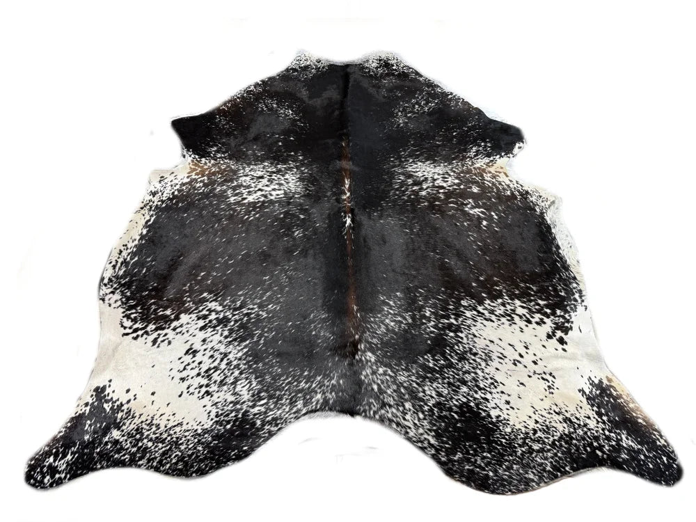 SaltPepTRI 452 large cowhide rug in black and white spotted pattern with a natural shape cowhides make beautiful rugs