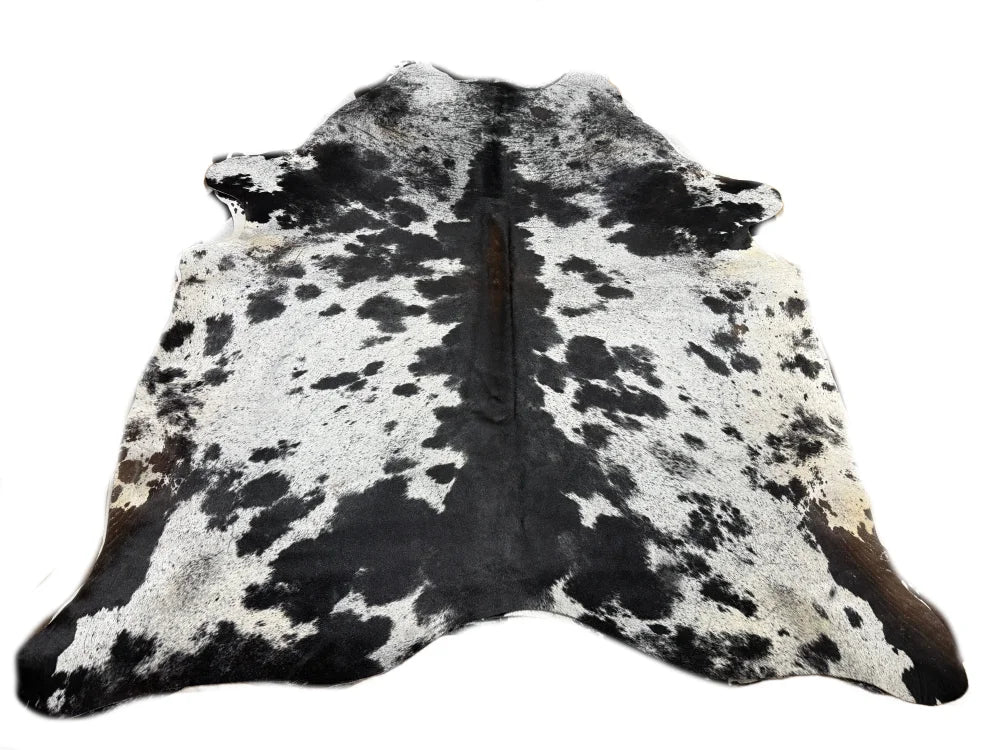 Black and white spotted large cowhide rug with natural texture from saltpeptri570 beautiful rugs arriving soon