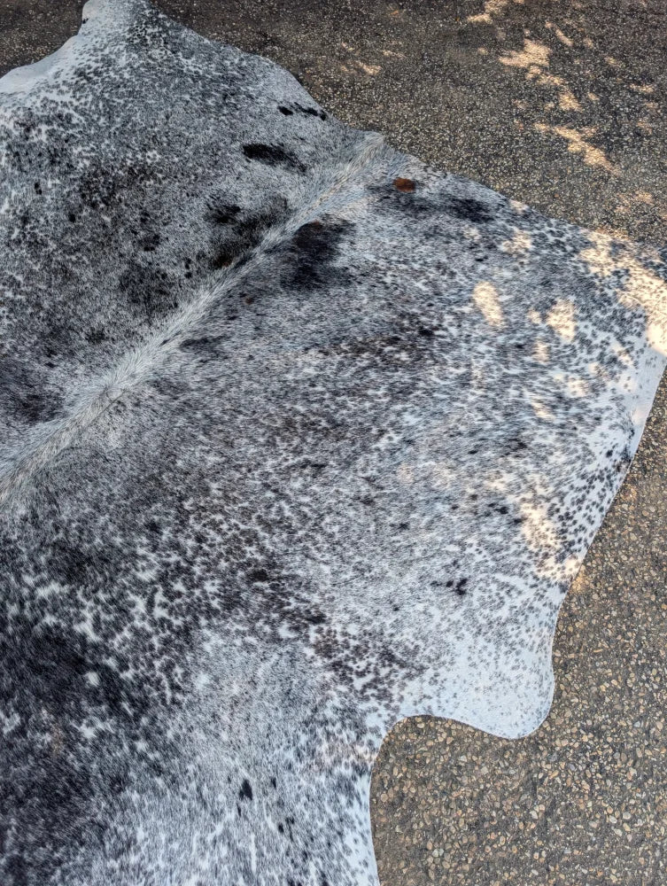 Large cowhide rug saltpeptricolour in gray and black with unique characteristics and rustic charm and natural edges