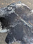 Saltpeptricolour large cowhide rug with black and white spots and natural textured surface offers rustic charm