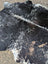 Large black and white spotted cowhide rug saltpeptricolour479 with natural fur texture and rustic charm unique characteristics