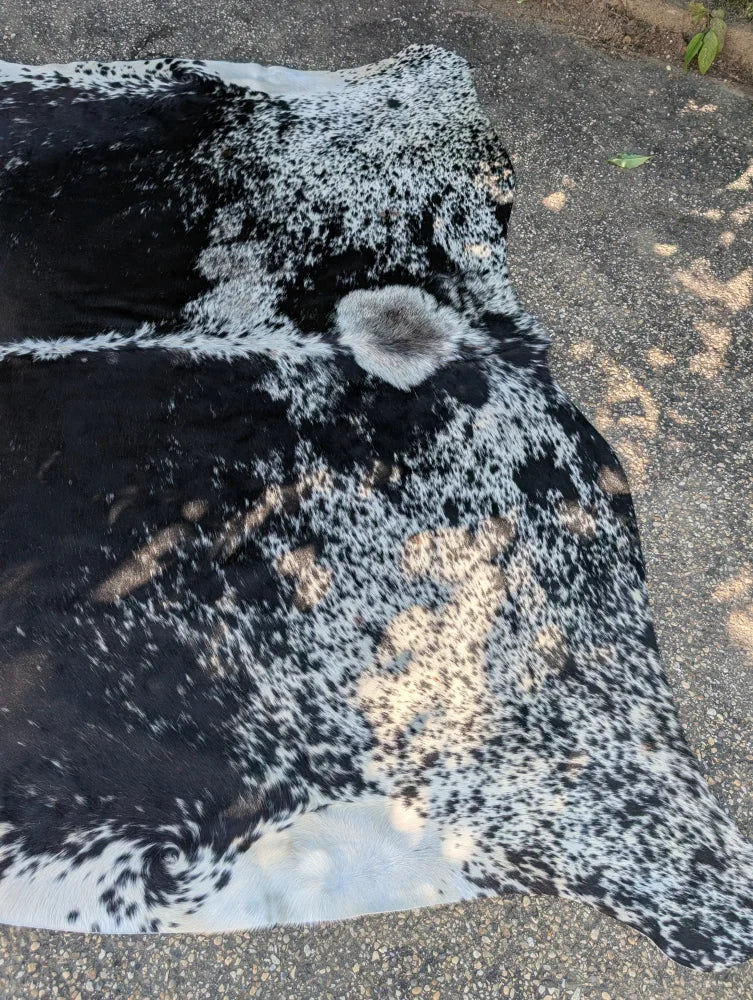 Large cowhide rug saltpeptricolour#479 with black and white spotted pattern and unique rustic charm