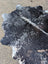 Large black and white cowhide rug saltpeptricolour 479 with unique characteristics and rustic charm natural edges