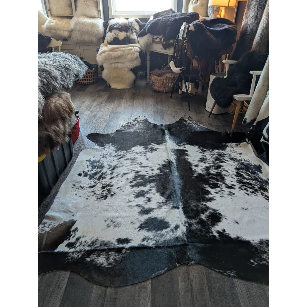 Extra large black and white cowhide rug salty5 with natural irregular patterns adds rustic charm to any space