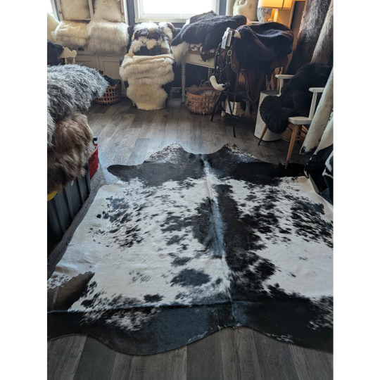Extra large black and white cowhide rug salty5 with natural irregular patterns adds rustic charm to any space